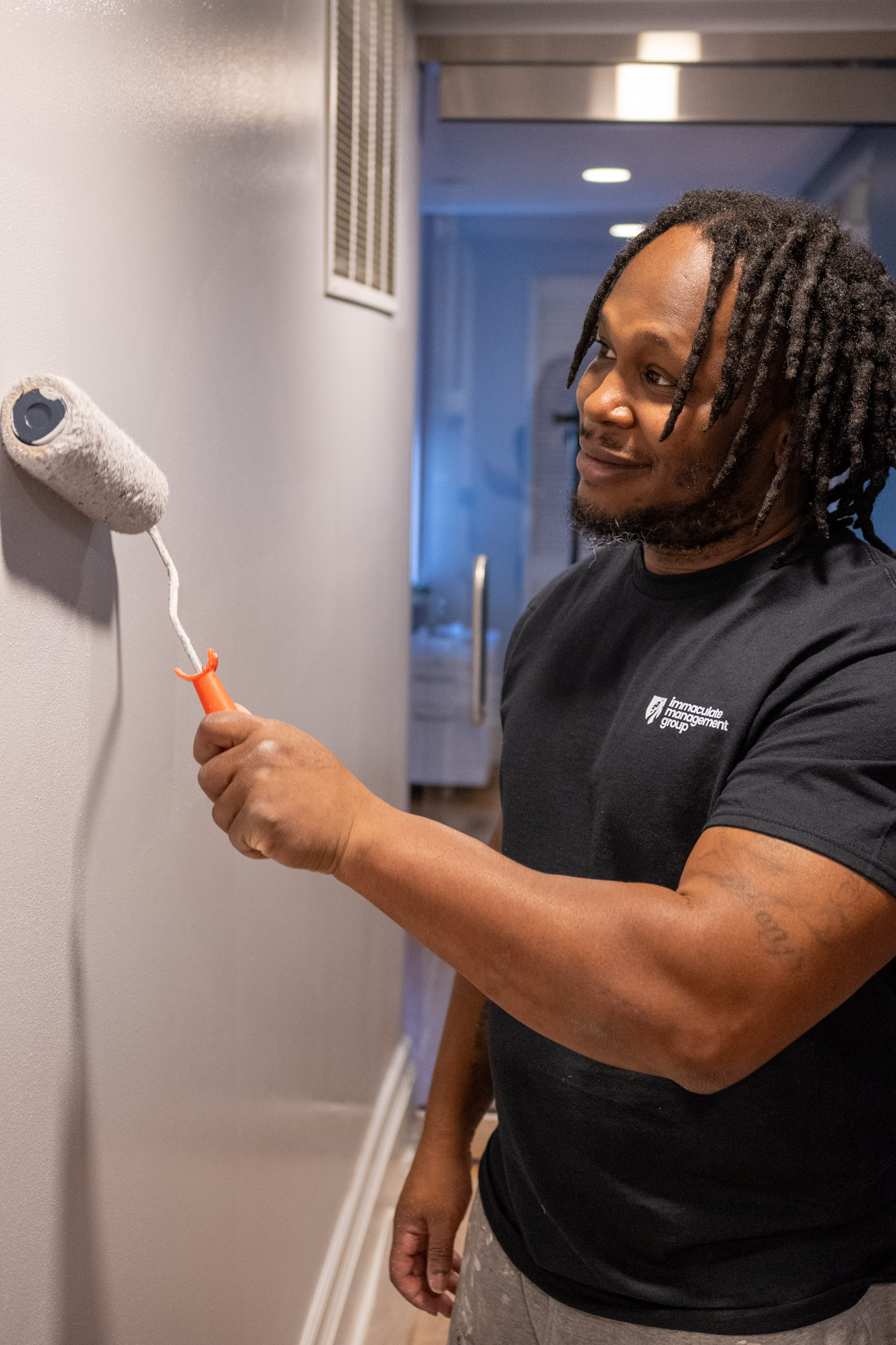 IMG worker painting interior wall